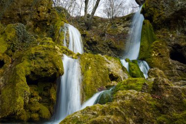 Beautiful Bachkovo waterfalls cascade in Rhodopes Mountain, Plovdiv region clipart