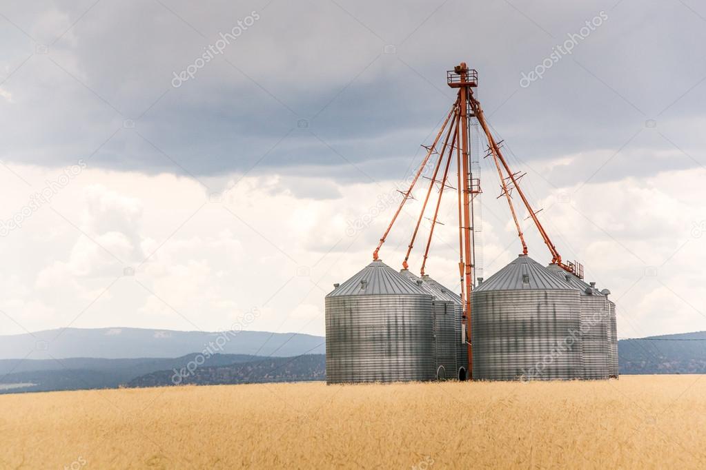 Grain Bins on a Stormy Day