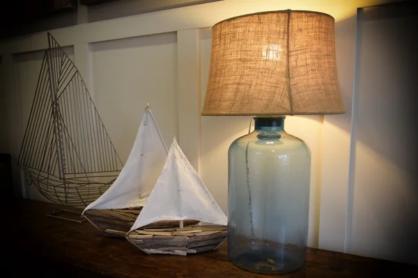 Abstract of several types of model sailboats and glass lamp — Stock Photo, Image