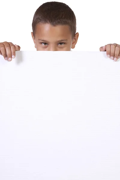 Cute little boy holding a blank sign — Stock Photo, Image