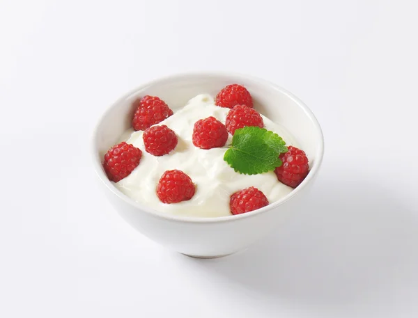 Raspberries in yoghurt — Stock Photo, Image