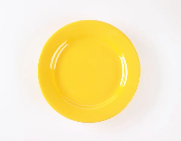 stock image yellow dinner plate