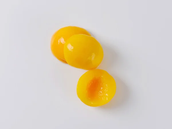 Консерви персика половинки — стокове фото