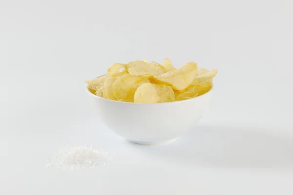 Bowl of salted potato chips — Stock Photo, Image