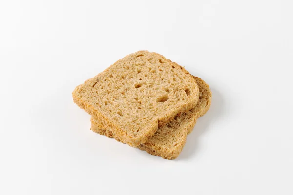 Fatias de pão de grão inteiro — Fotografia de Stock