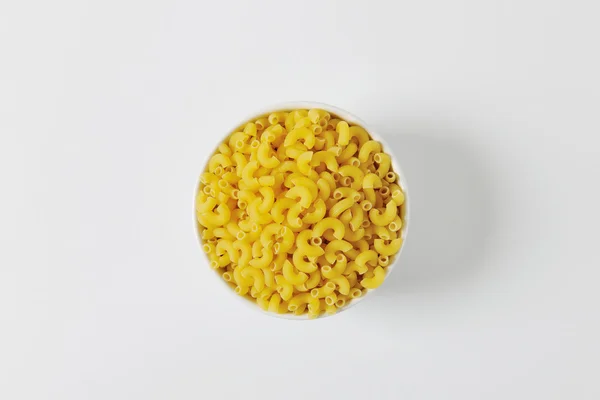Bowl of dried macaroni — Stock Photo, Image