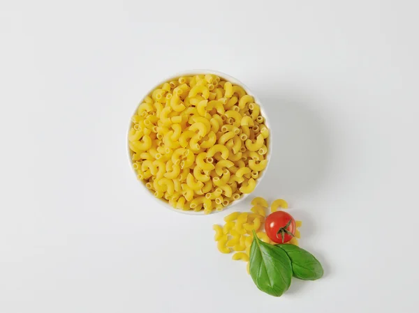 Bowl of dried macaroni — Stock Photo, Image
