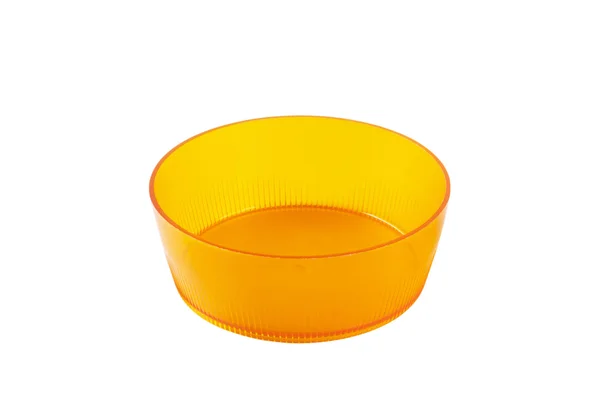 丸いオレンジ色のプラスチックのお皿 — ストック写真
