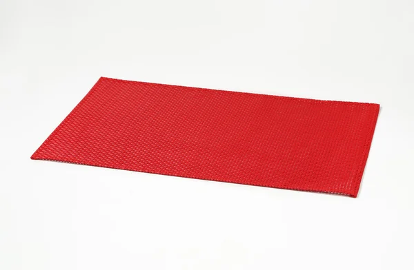 Plástico vermelho placemat — Fotografia de Stock