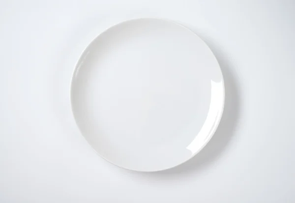 Puccs alakú fehér lemez — Stock Fotó