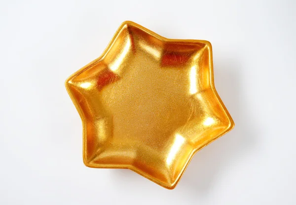 Zlatá hvězda ve tvaru mísy — Stock fotografie