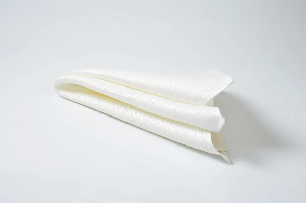 Guardanapo branco dobrado — Fotografia de Stock