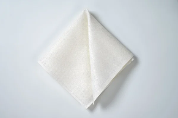 Folded white napkin — Stock Photo, Image