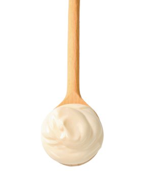 Ekşi krema bir tahta kaşık üzerinde
