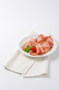 Thin slices of Black Forest ham clipart