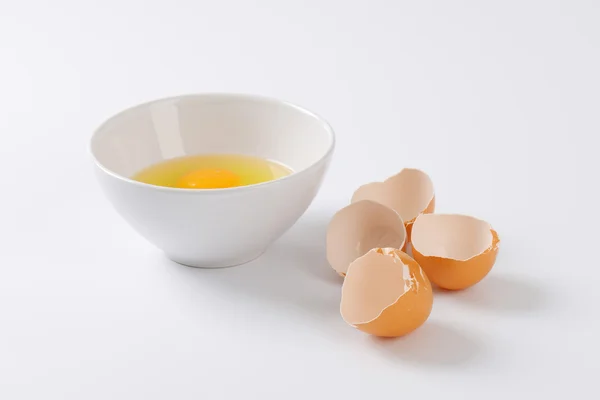 Cracked eggs in a bowl — Stock Photo, Image