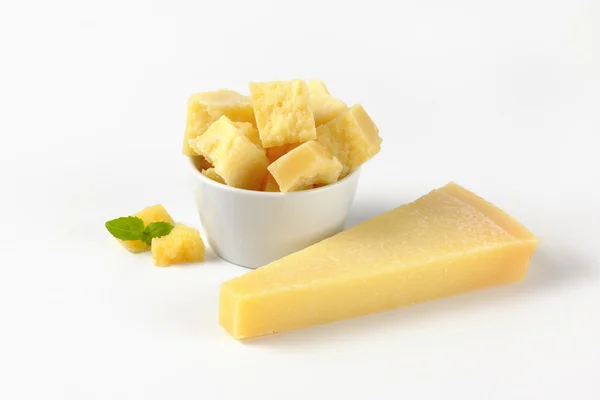 Bowl and wedge of parmesan cheese — Stock Photo, Image