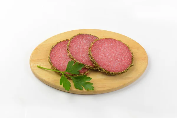 Pepper coated salami — Stock Photo, Image