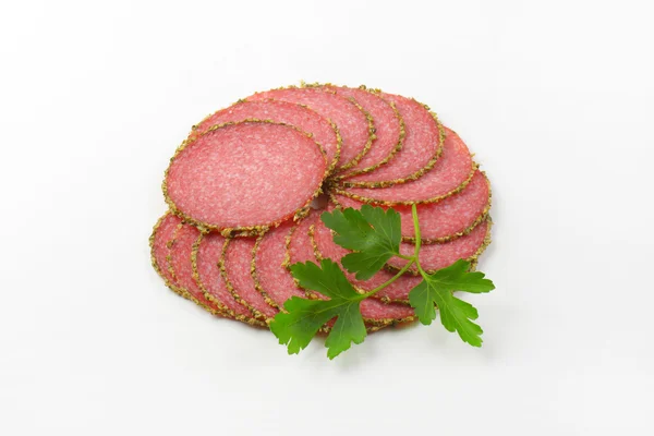 Slices of pepper salami — Stock Photo, Image