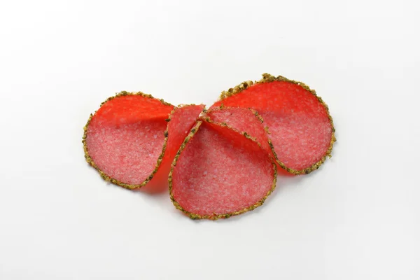 Slices of pepper salami — Stock Photo, Image