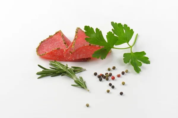 Slices of pepper salami — Stock Photo, Image