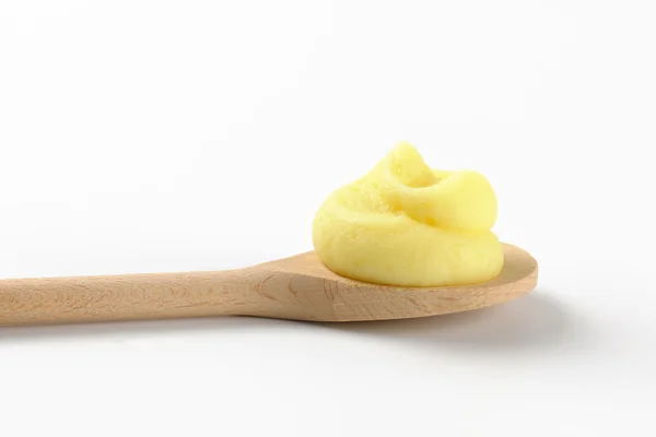 Mashed potatoes on wooden spoon — Stock Photo, Image