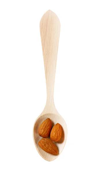 Raw almonds on wooden spoon — Stock Photo, Image