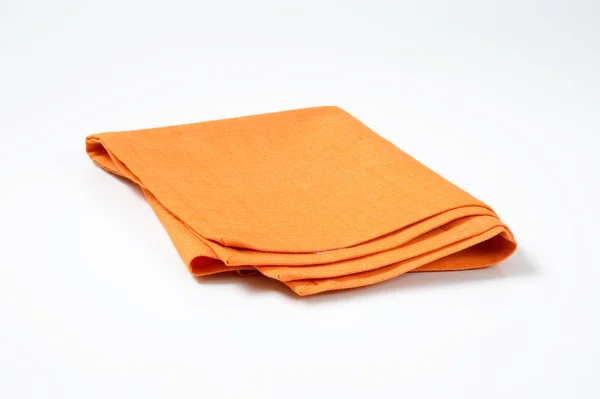Gefaltete orange Serviette — Stockfoto