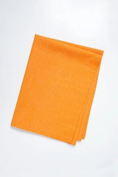 Gefaltete orange Serviette — Stockfoto