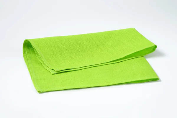 Сложенная зелёная салфетка — стоковое фото