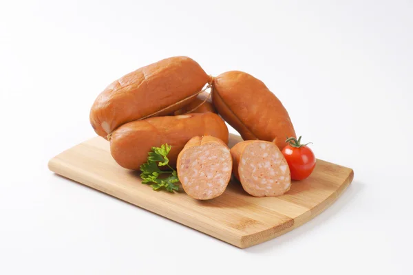 Uncooked short sausages — Stock Photo, Image