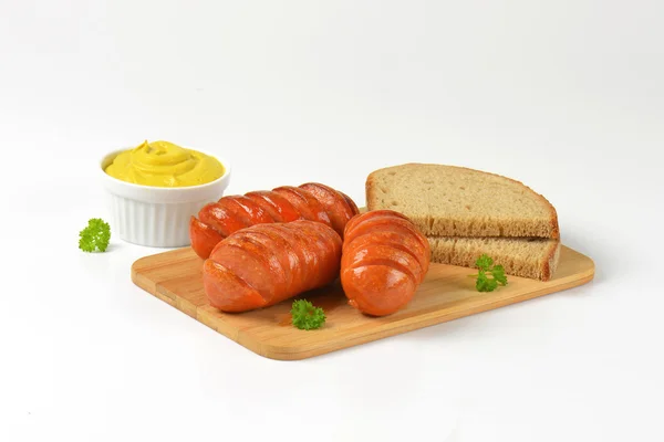 Sausages, mustard and bread — Stock Photo, Image