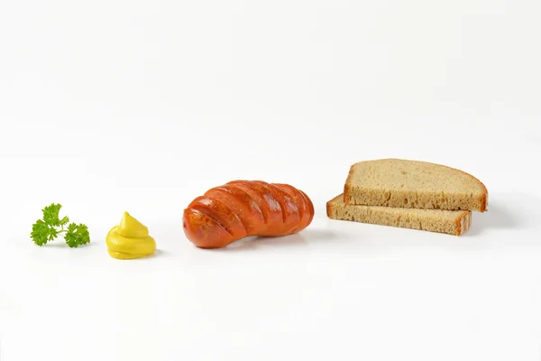 Salsiccia arrosto, senape e pane — Foto Stock