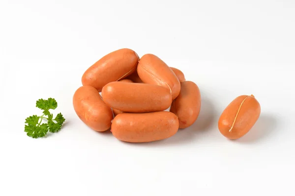 Raw short sausages — Stock Photo, Image