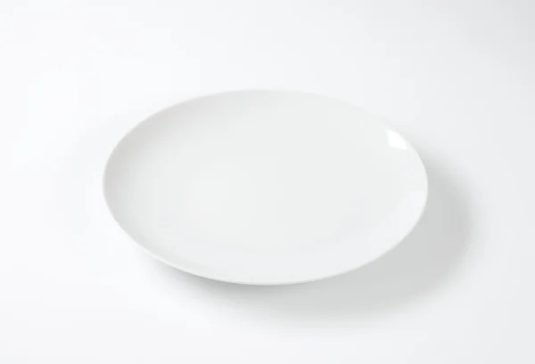 Round white plate — Stock Photo, Image