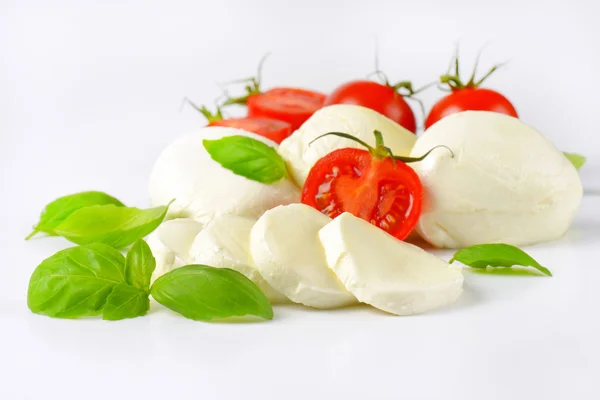 Mozzarella, tomatoes and basil — Stock Photo, Image