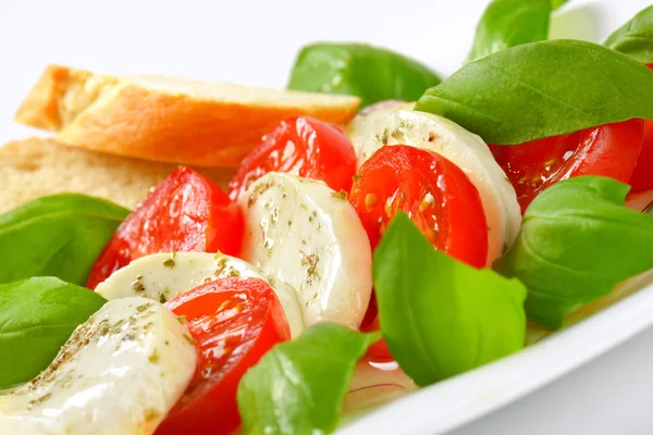 Caprese salad with bread — Stock Photo, Image