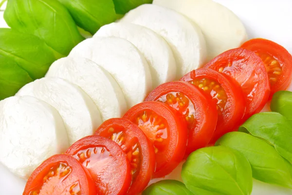 Mozzarella, tomatoes and basil — Stock Photo, Image