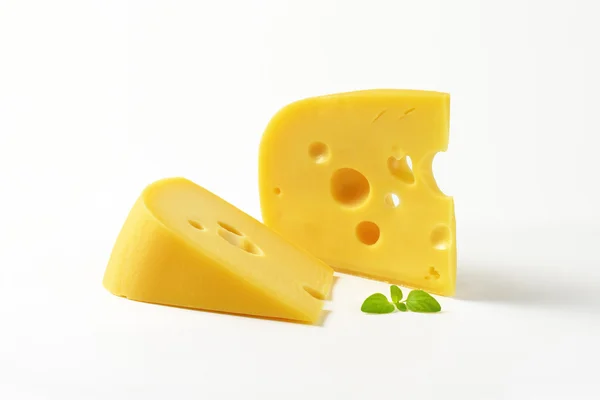 Wedges of yellow cheese with eyes — Stock Photo, Image