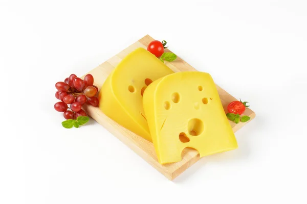 Swiss cheese with red grapes — Stock Photo, Image