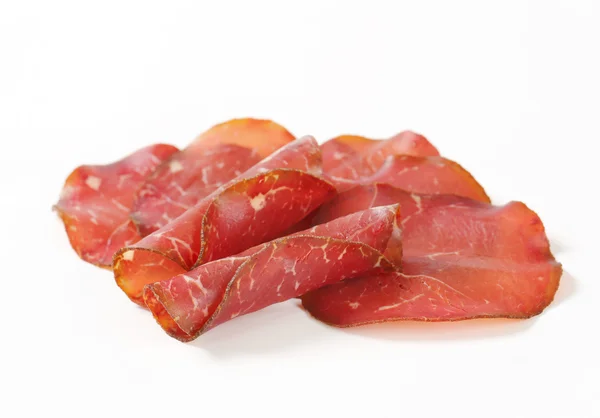 Thin slices of dried meat — Stock Photo, Image