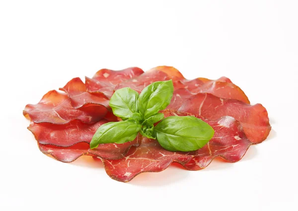 Thin slices of dried meat — Stock Photo, Image