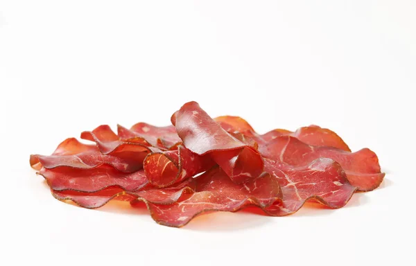 Thin slices of dried meat — Stock Photo, Image