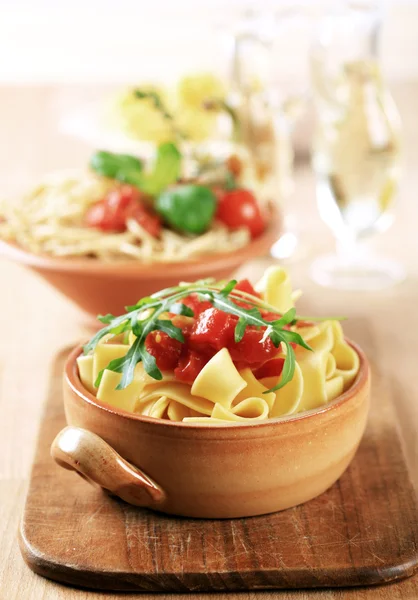 Ribbon pasta and peeled tomato — Stock Photo, Image