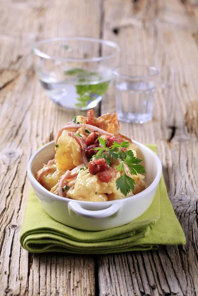 Potato dish on wooden background — Stock Photo, Image