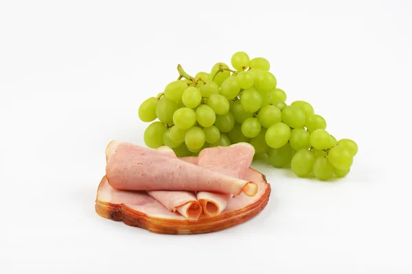 Ham slices and grapes — Stock Photo, Image