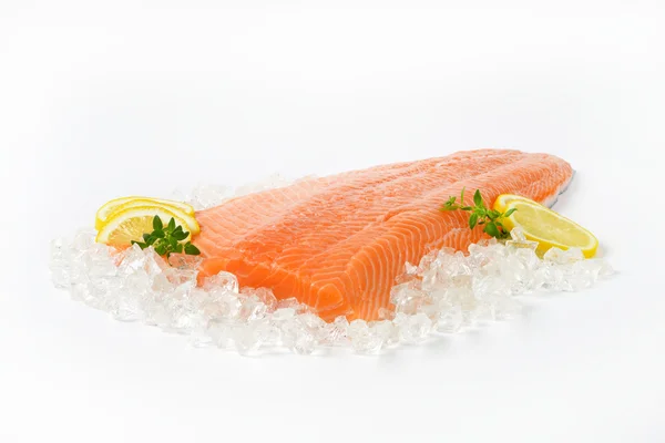 Raw salmon fillet on ice — Stock Photo, Image