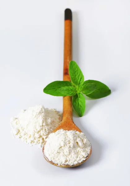 Wheat flour on wooden spoon — Stock Photo, Image