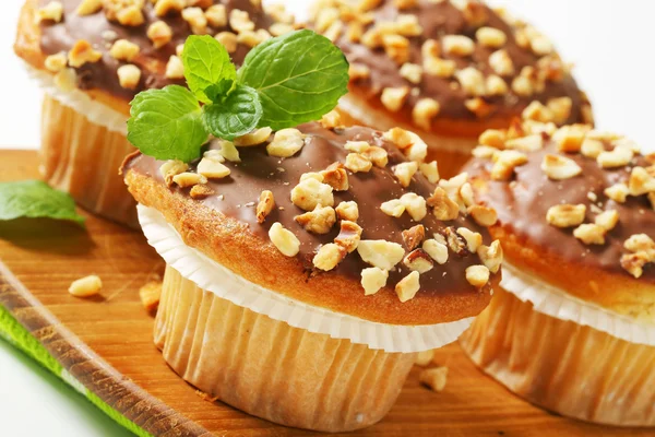 Chocolate glazed muffins — Stock Photo, Image