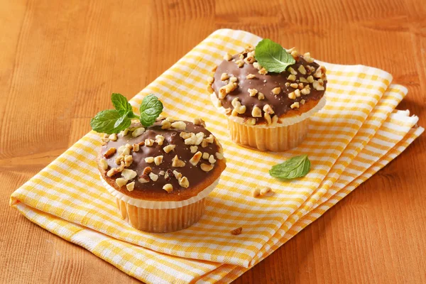 Chocolate glazed muffins — Stock Photo, Image